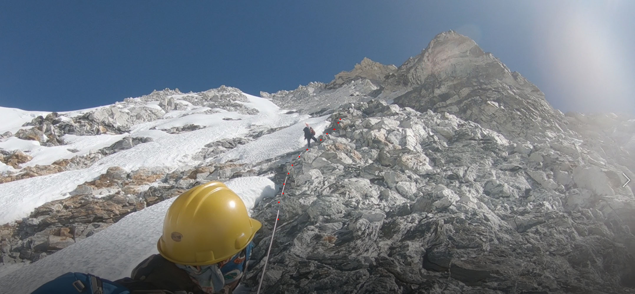 The culloir leads to the ridge on the right at which leads to the summit.